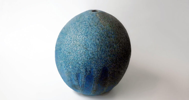 Andersen Design Vase made from a mold of a melon glazed in a variegated blue with a double layer at the top that flows down the form in an irregulated pattern